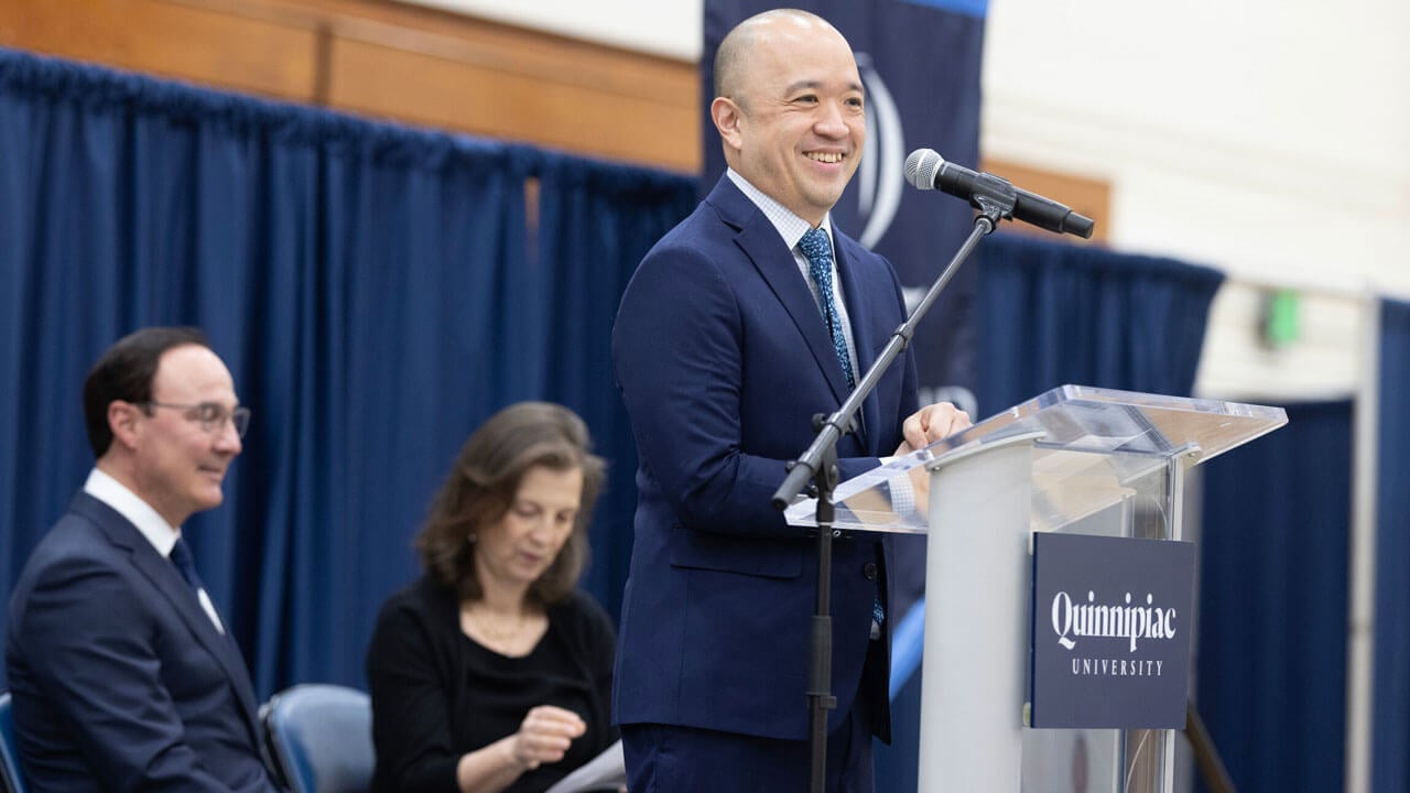 Steve Paik smiles while giving his speech to the Class of 2024