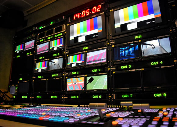 Screens with different images in a control room