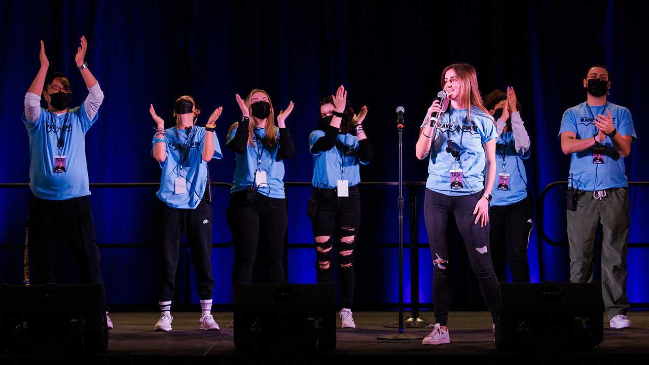 Shannon Flaherty speaks from stage with her executive board.