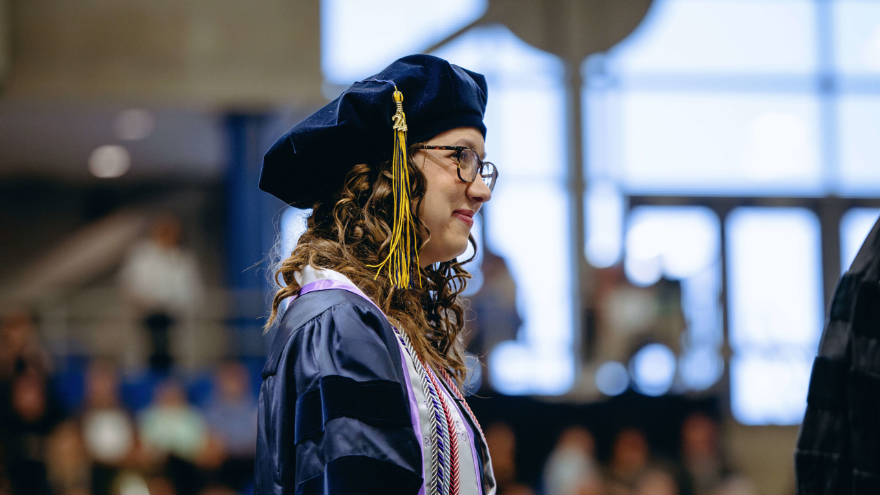 School of Law student smiles while turned to the side