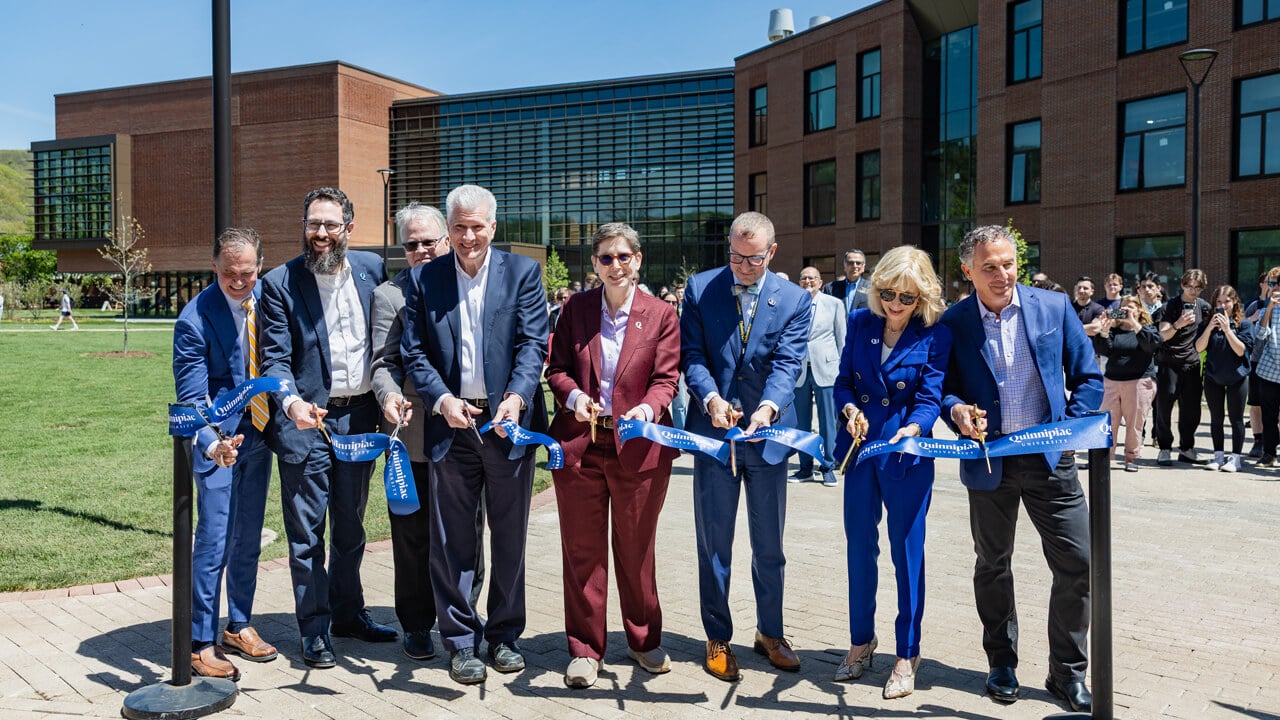 Group cuts a ribbon