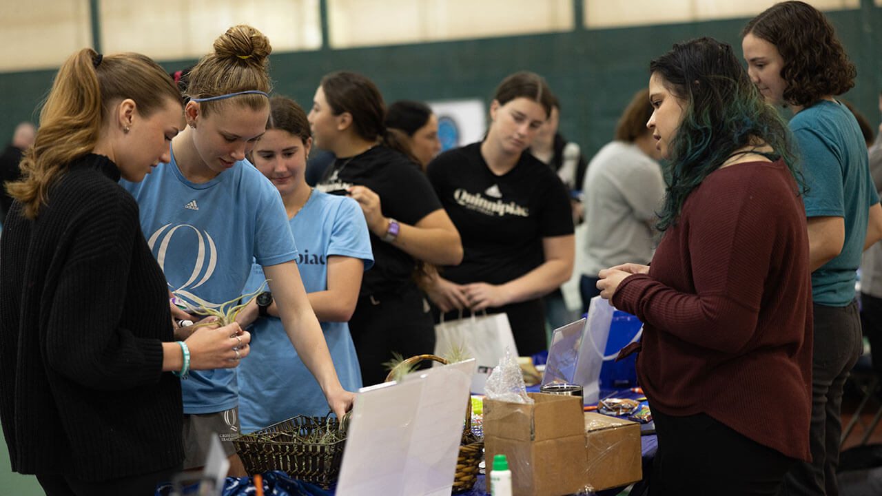 Students looking at health fair table