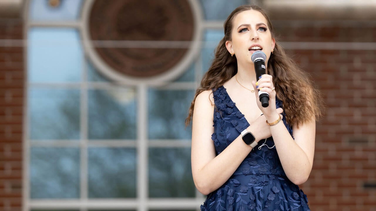 Julia Orlofski singing during the commencement ceremony