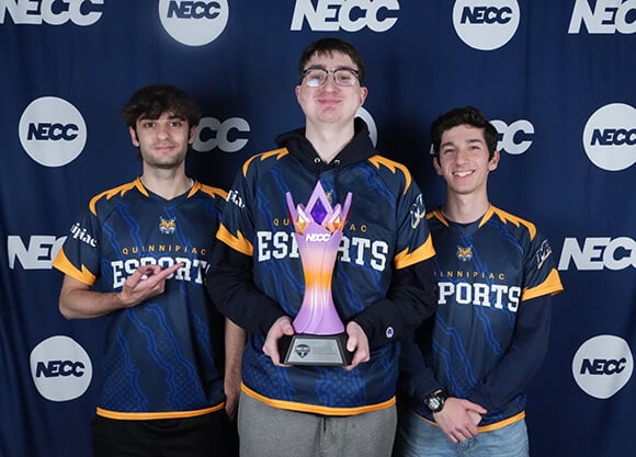 esports Rocket League team with their national championship trophy