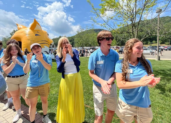 President Marie Hardin stands with Orientation Leaders
