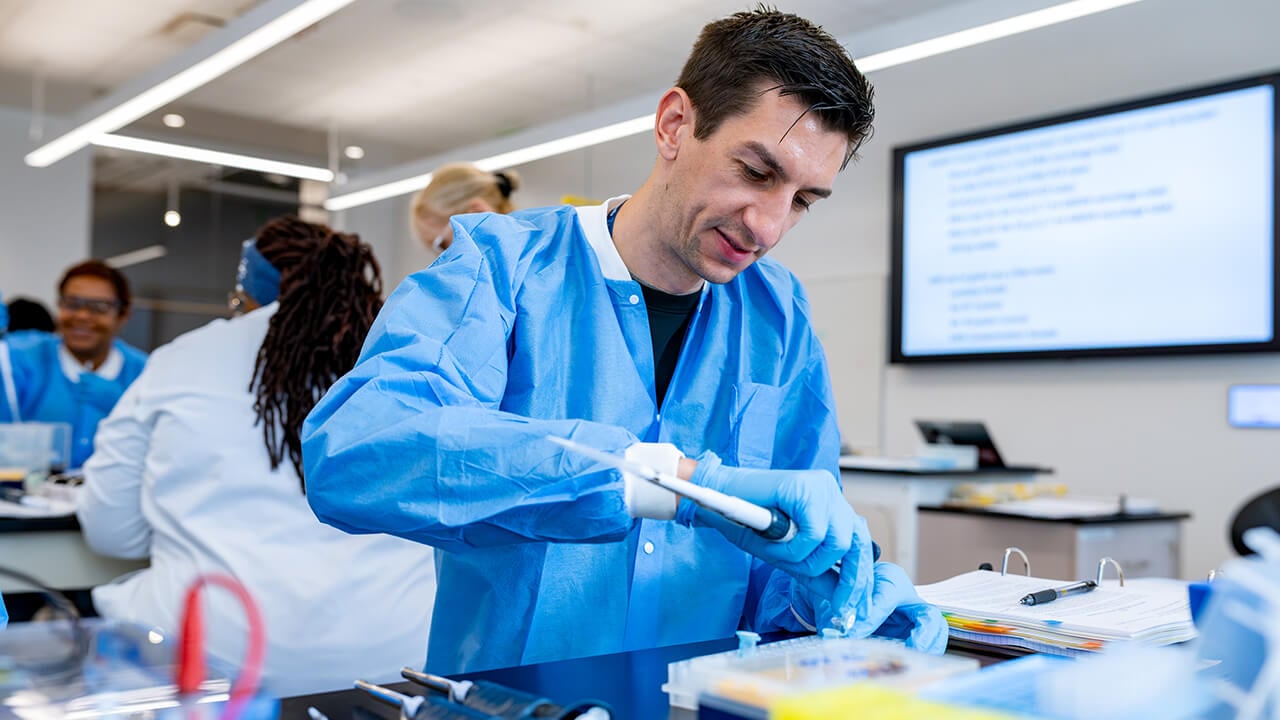 Workshop participant using pipette tools