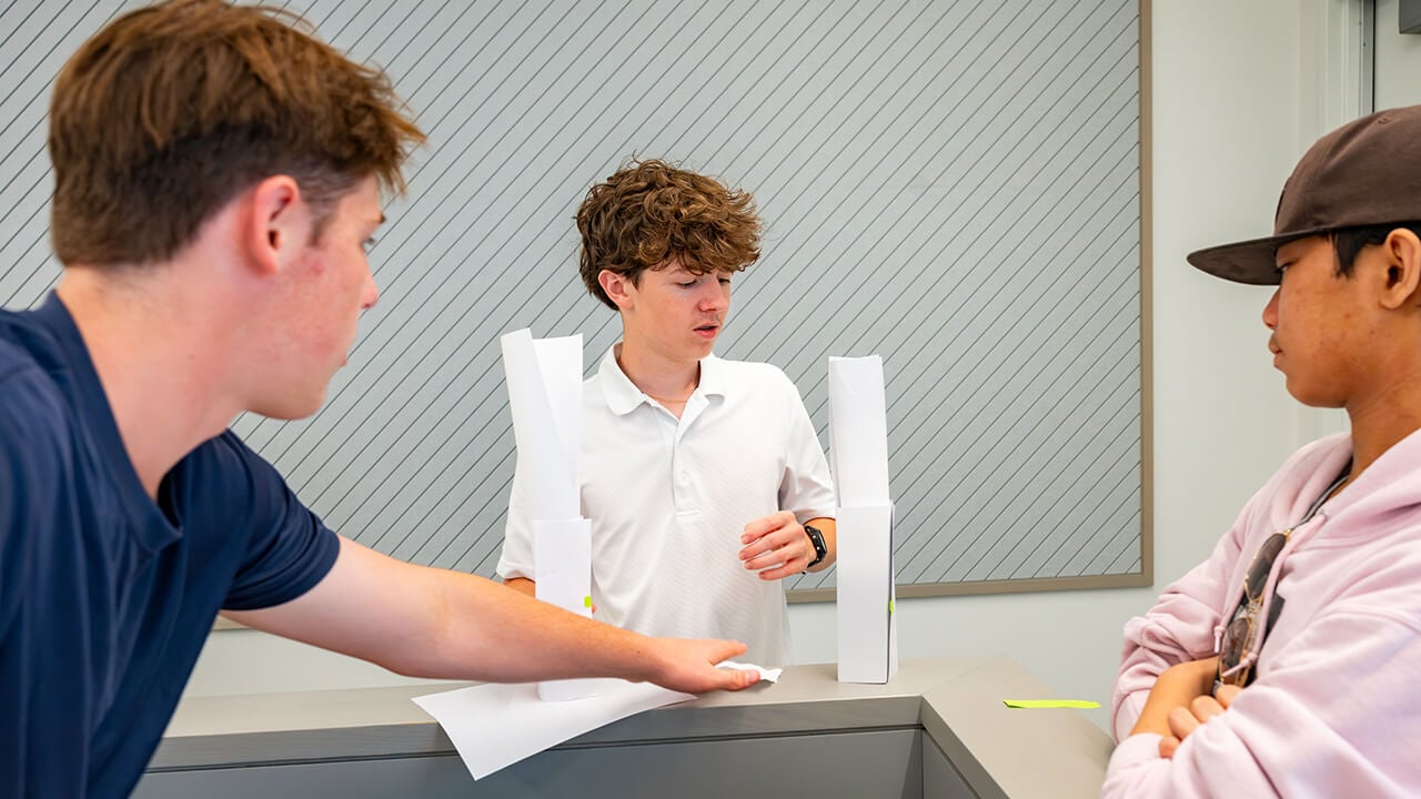 Students stacking two paper towers