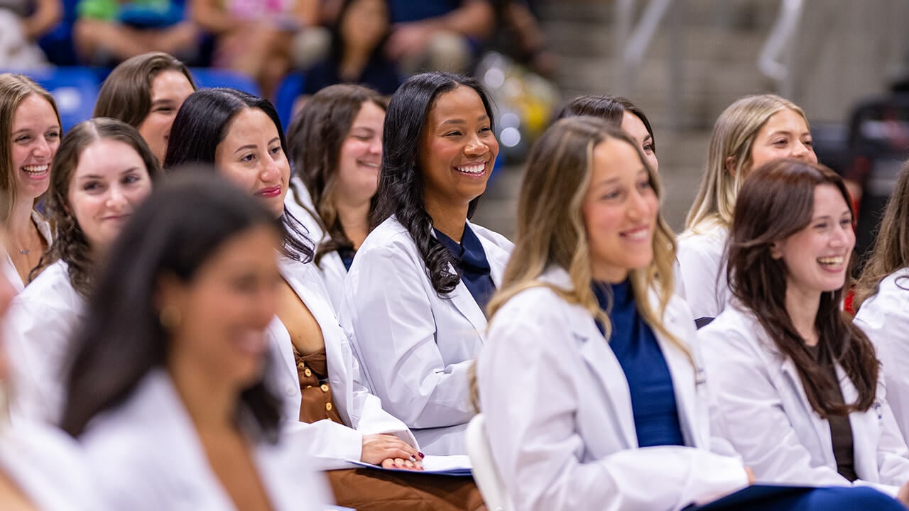 Students looking up at the stage