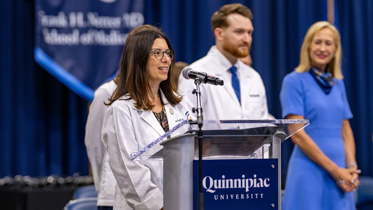 Dean speaking at podium
