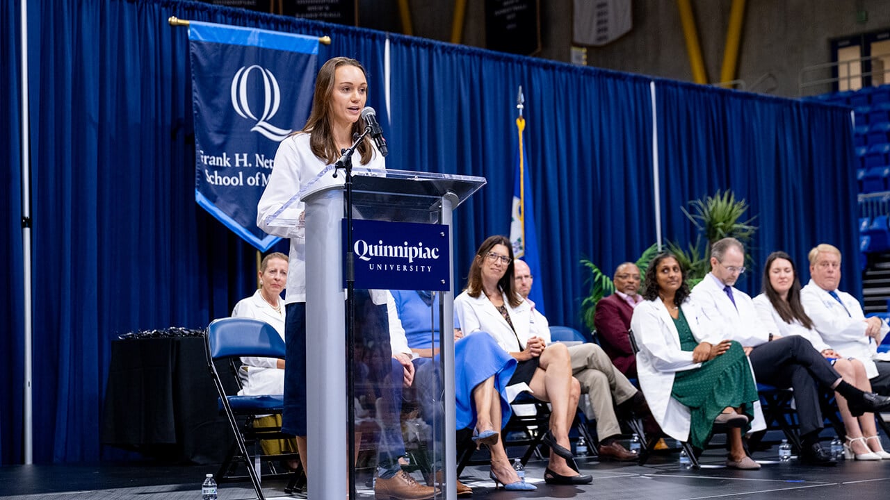 Student speaking at podium