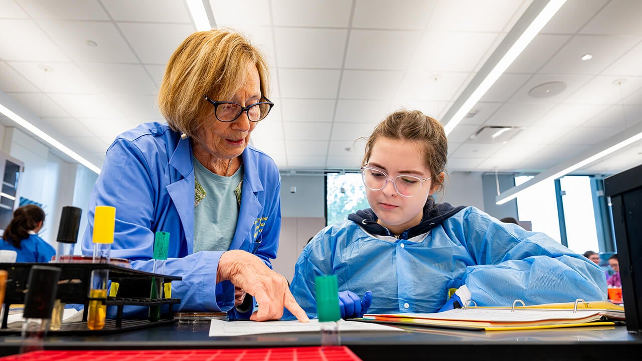 Instructor showing student how to complete lab