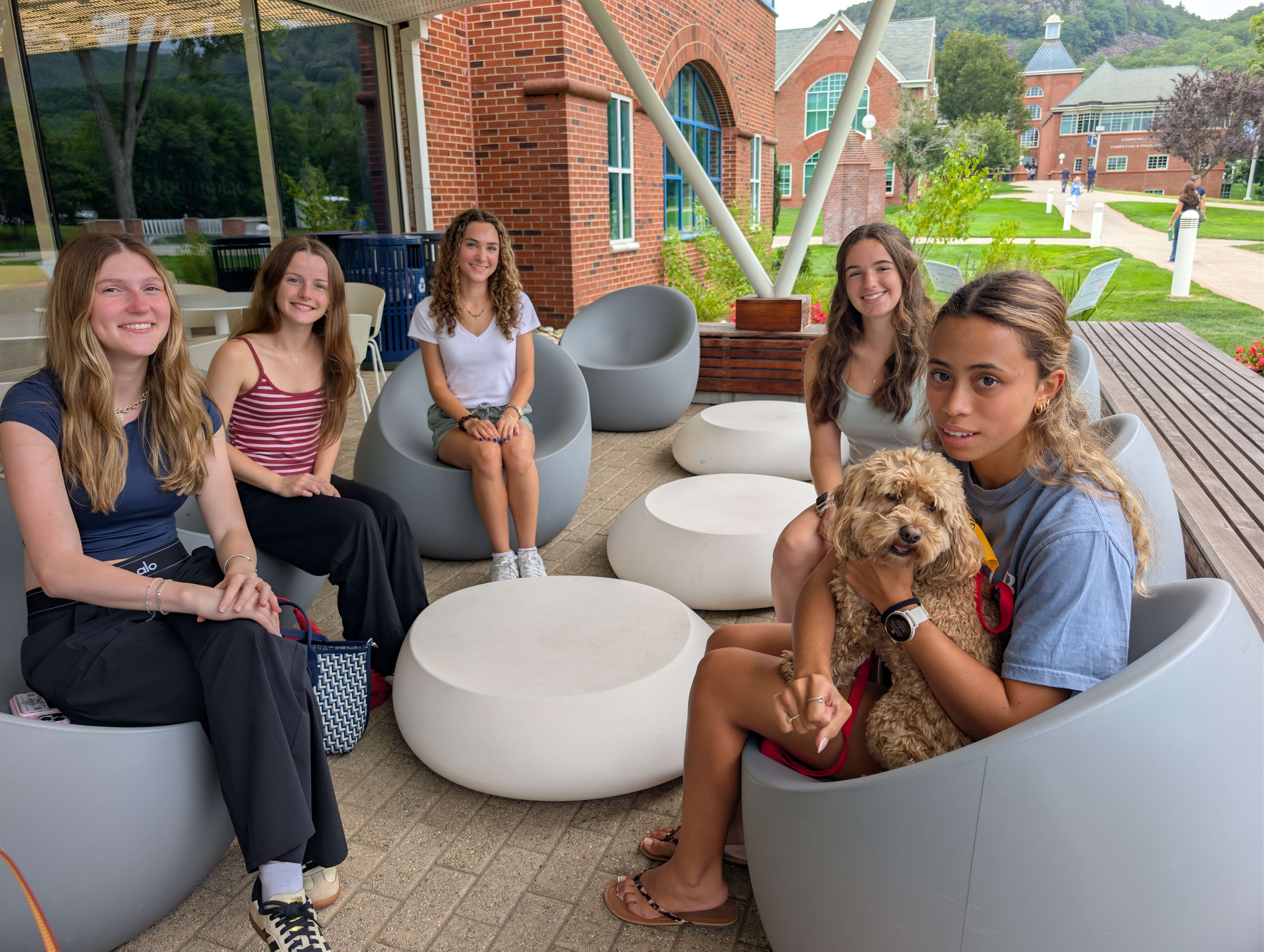 Students pose with dog