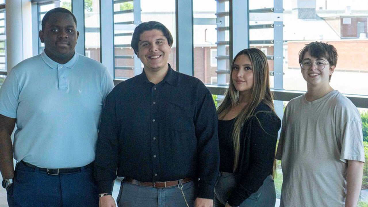 Four students who participated in the Silver Scholars program