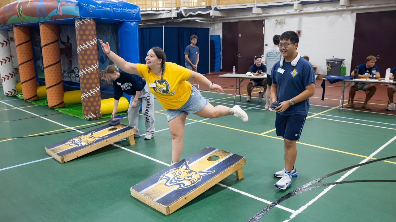 Students playing corn hole