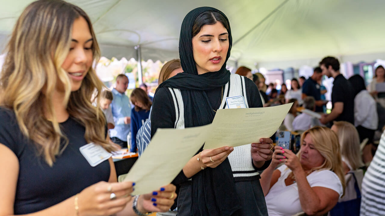 Students reading the law oath during orientation