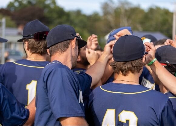 Club Baseball athletes in a huddle