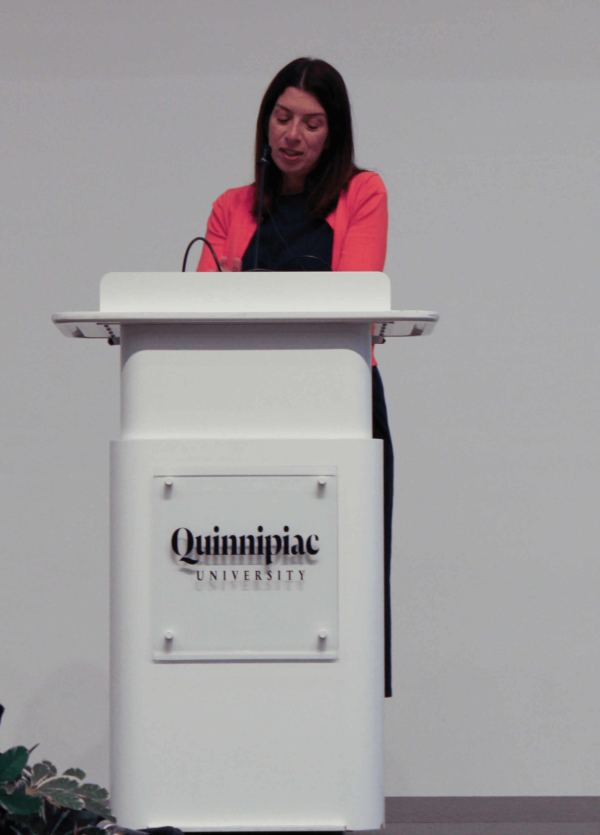 Lisa Coplit speaks at the Quinnipiac podium during the 9/11 Teach-In.