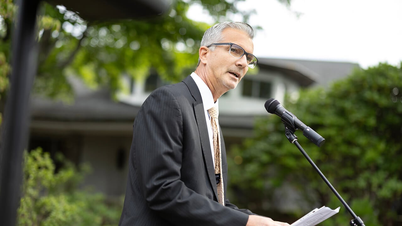 Jason Burke giving remarks