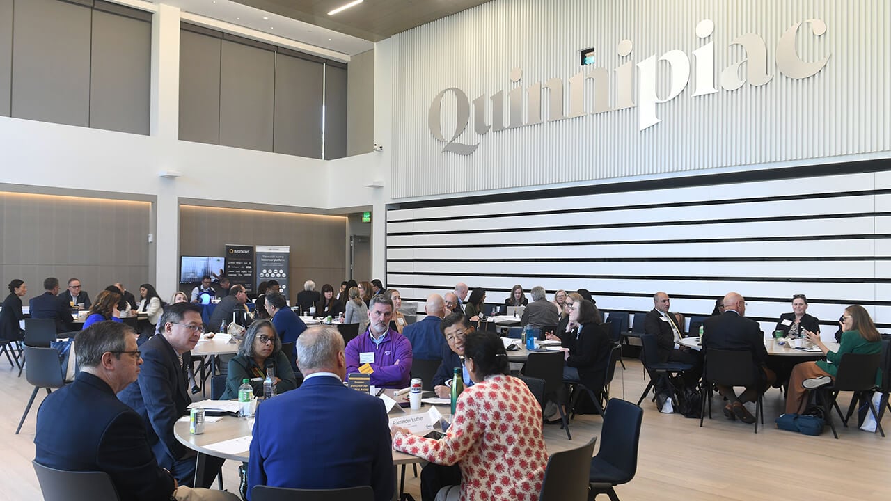 Groups have conversations at respective tables