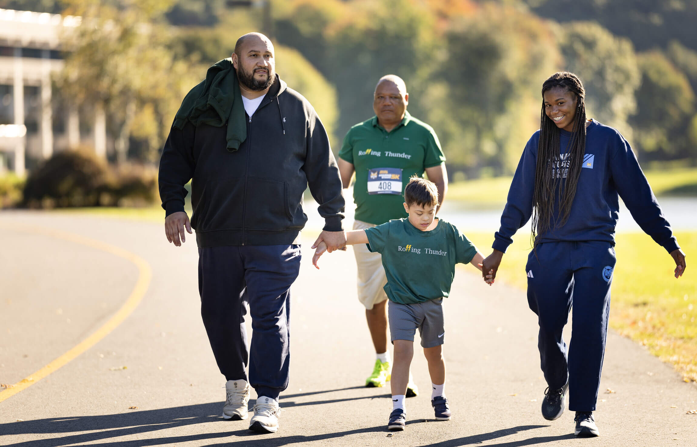 A group walking with a small child.