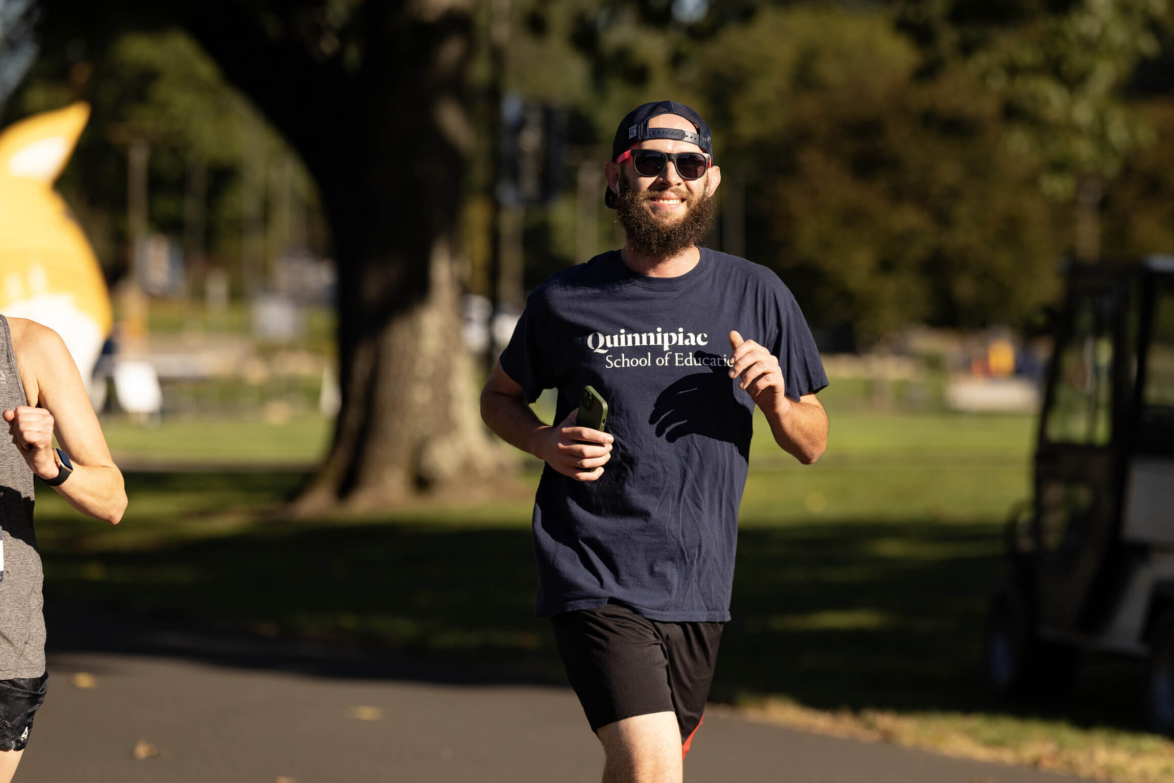 A runner sporting a Quinnipiac School of Education shirt.