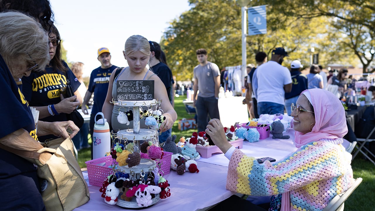 People at a vendor table.