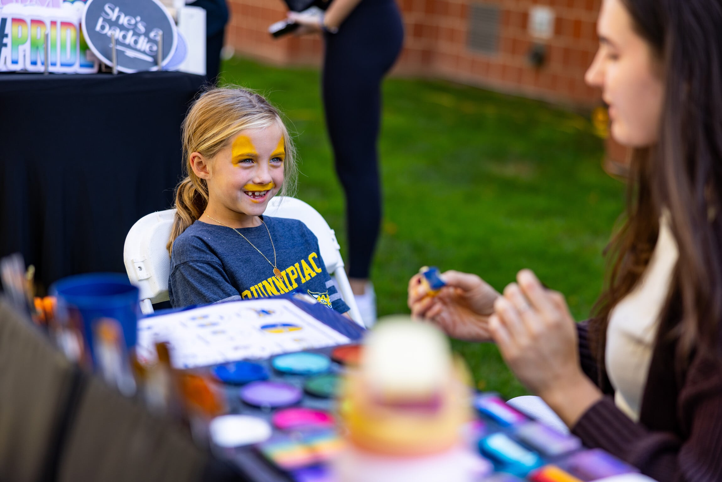 A child with face painting.
