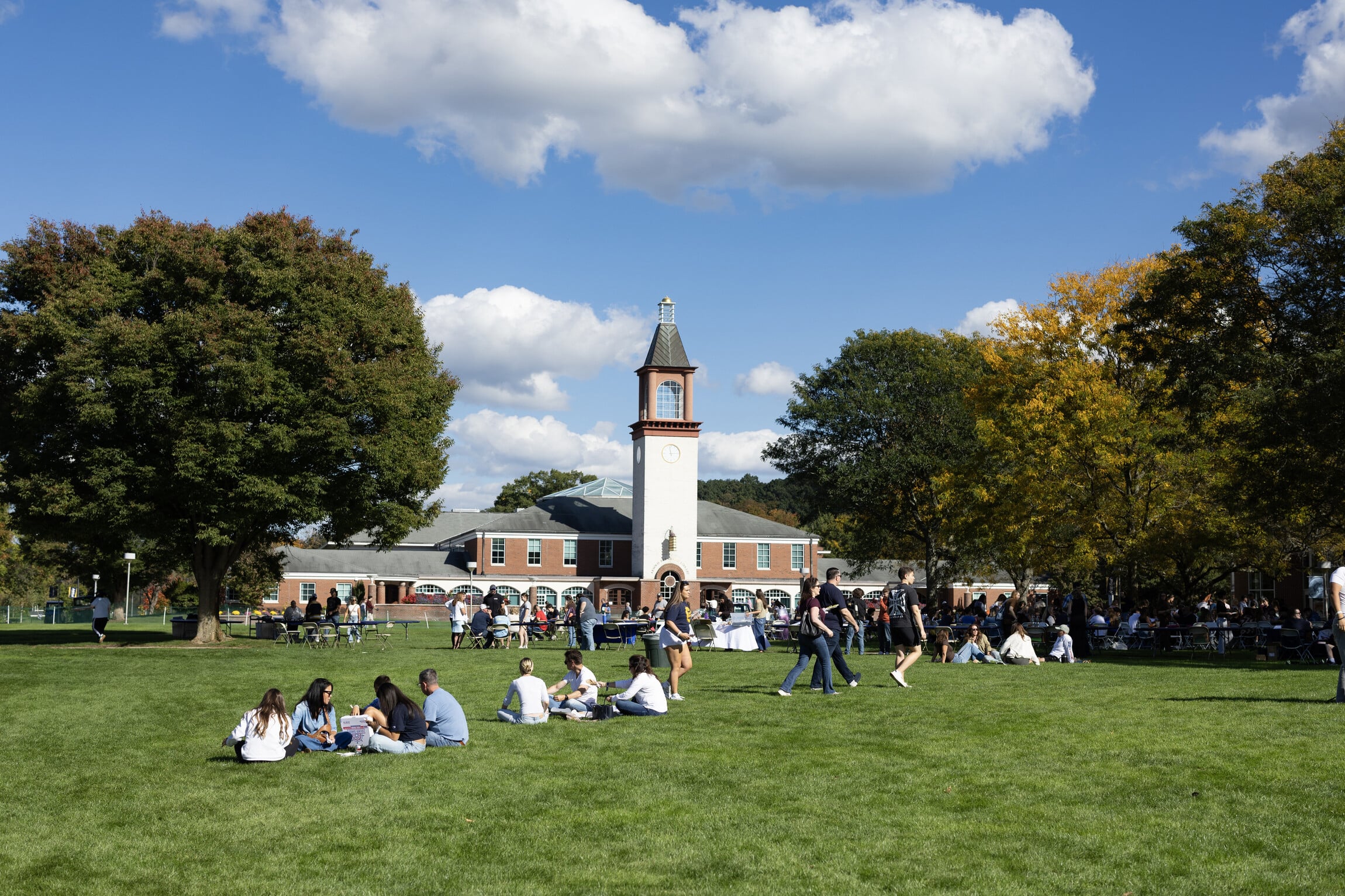 A view of people gathered outside of the library.