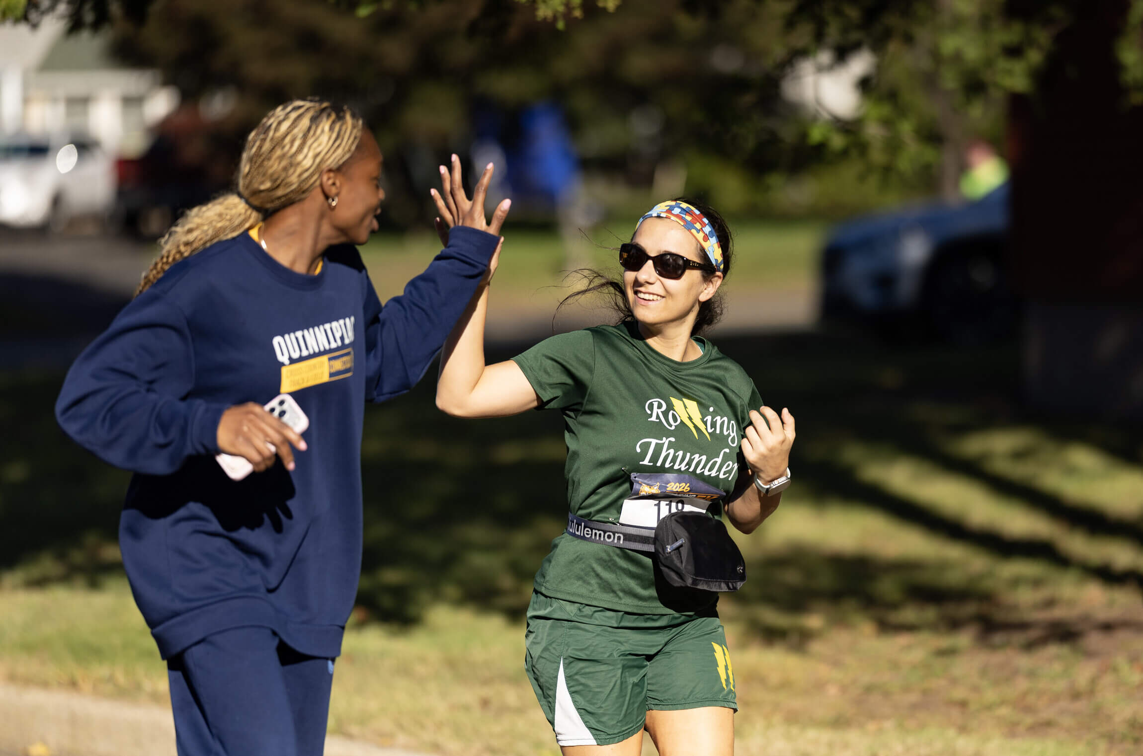 Two people high-fiving during the run.