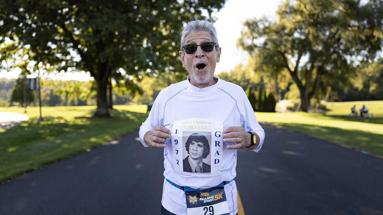 A runner posing with a customized shirt.