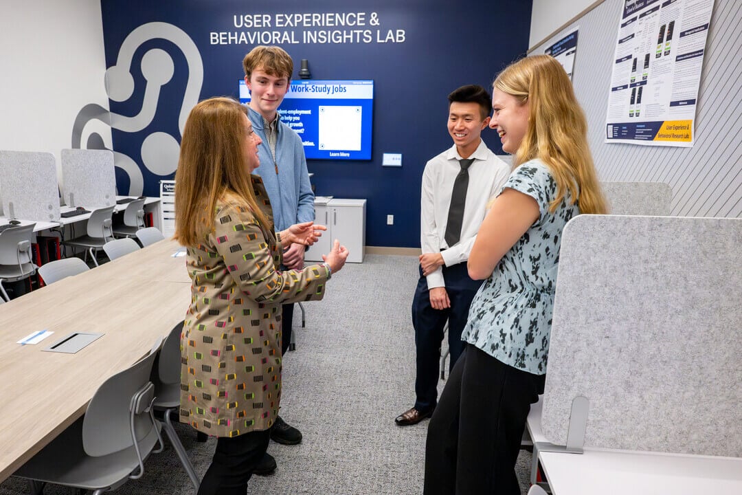 Students having conversation inside Behavioral Lab.