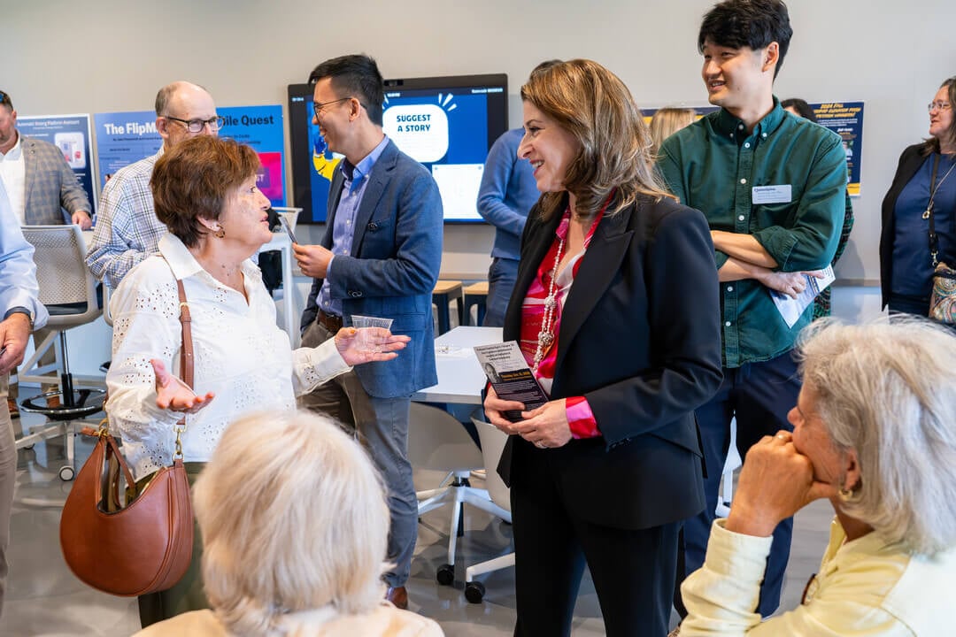 Dean Holly Raider speaks with attendees of the Behavioral Lab ceremony.