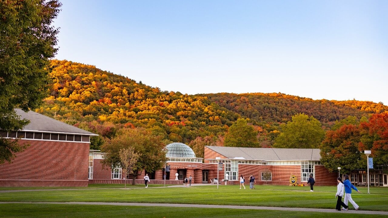 The fall foliage of the Sleeping Giant State Park behind the Mount Carmel Campus.