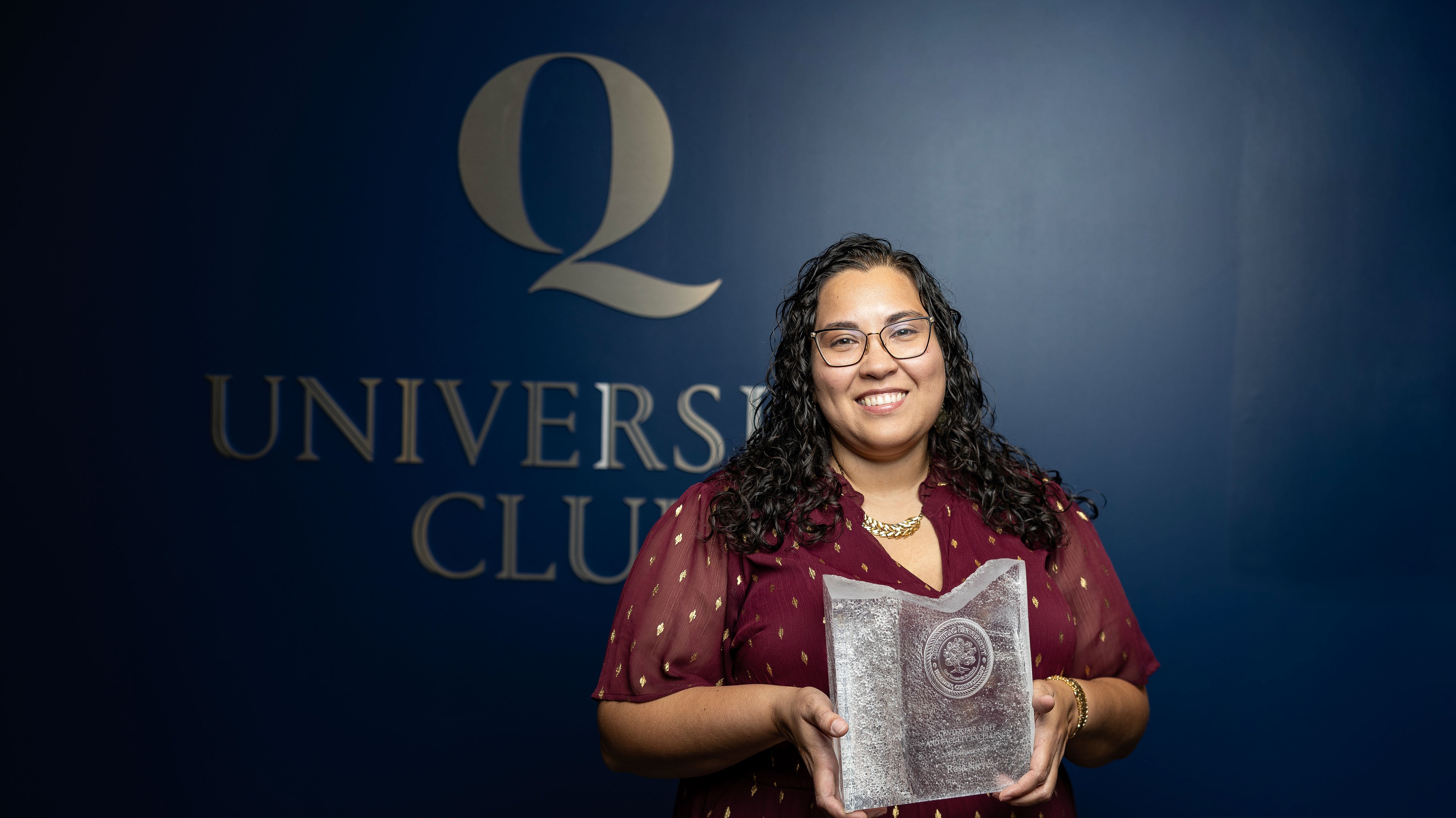Rosa Nieves poses with her award.